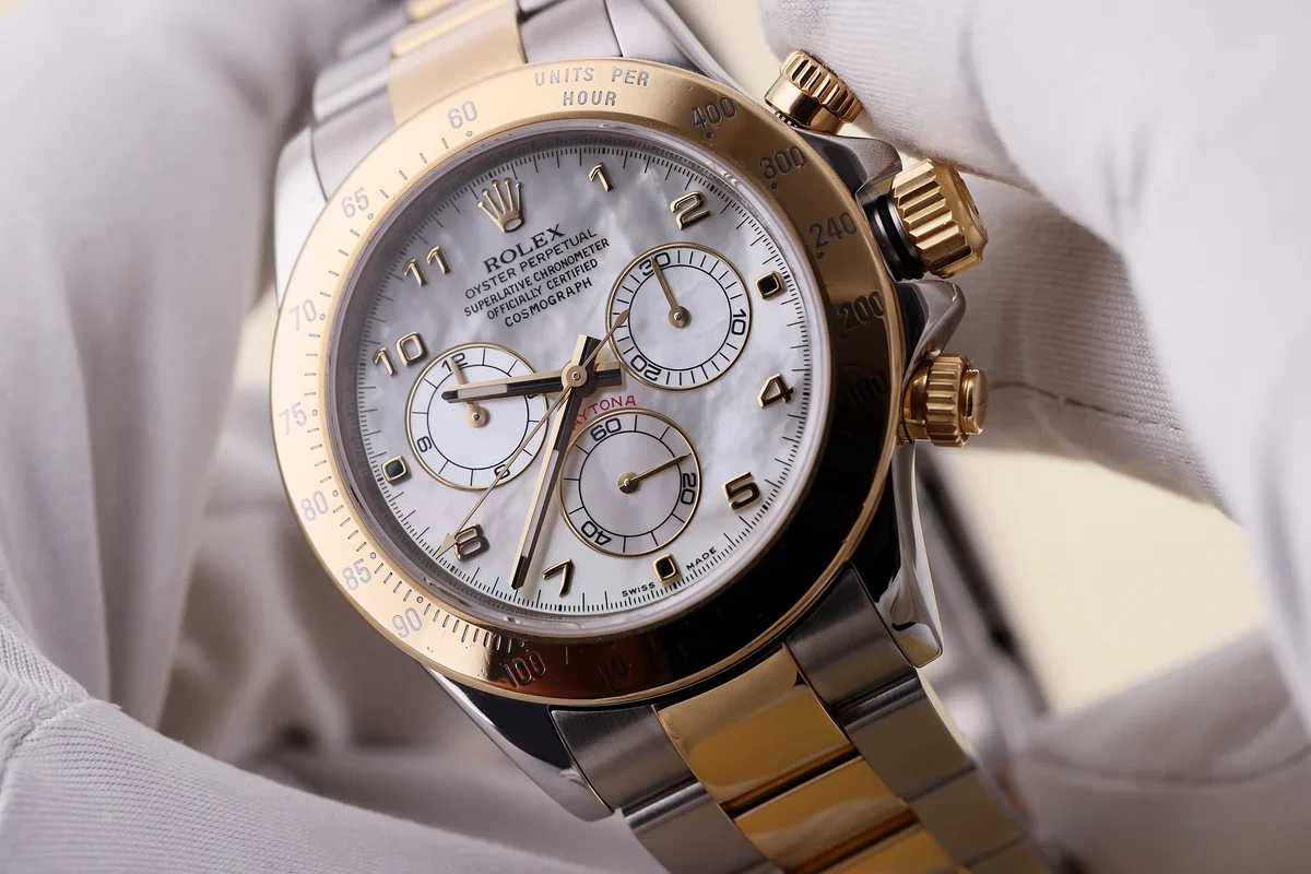 Rolex Daytona with mother-of-pearl dial in watchmaker's gloves